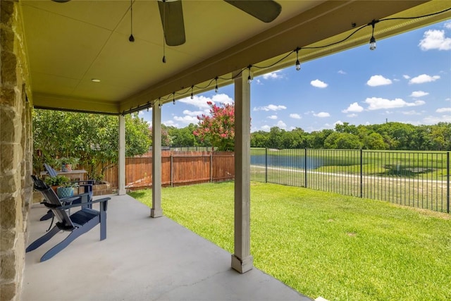 3204 Herrero Path, Cedar Park, TX 78641 - fenced backyard featuring a ceiling fan, a patio, view of scattered trees, and a water view