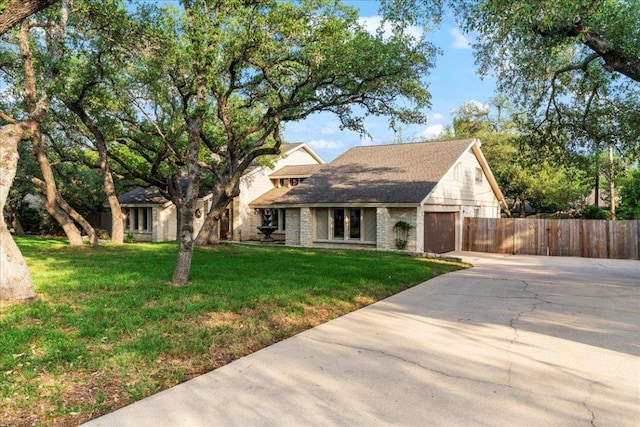 10601 Spicewood Pkwy, Austin, TX 78750 - view of front facade featuring driveway, an attached garage, and brick siding