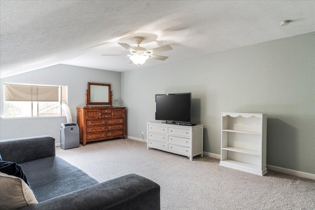 10601 Spicewood Pkwy, Austin, TX 78750 - bedroom with carpet floors, lofted ceiling, a ceiling fan, and a textured ceiling