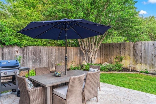 10601 Spicewood Pkwy, Austin, TX 78750 - fenced backyard featuring a patio, area for grilling, and outdoor dining area