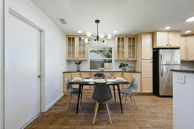 9224 Partridge Cir, Austin, TX 78758 - dining space featuring wood finished floors, recessed lighting, and a chandelier