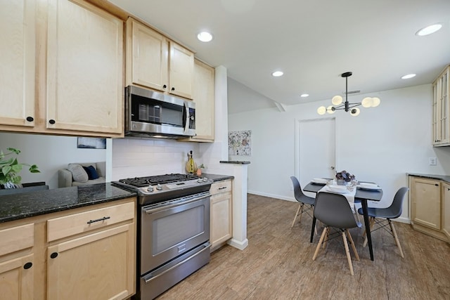 9224 Partridge Cir, Austin, TX 78758 - kitchen with appliances with stainless steel finishes, light brown cabinets, light wood finished floors, backsplash, and recessed lighting