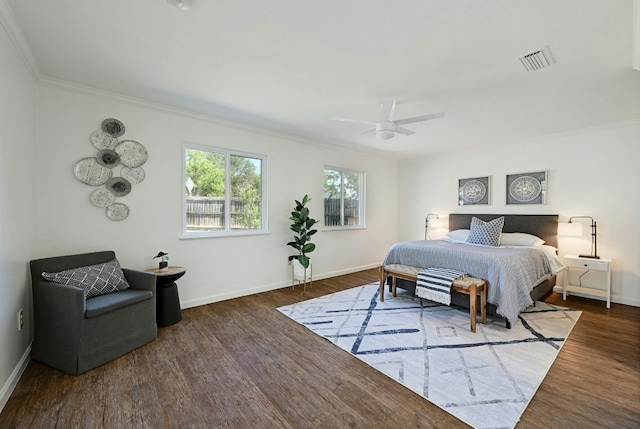 9224 Partridge Cir, Austin, TX 78758 - bedroom with ornamental molding, wood finished floors, and ceiling fan