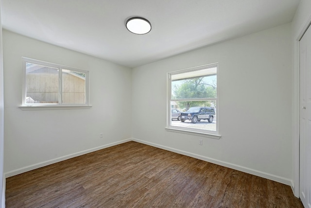 9224 Partridge Cir, Austin, TX 78758 - empty room with dark wood-type flooring and baseboards