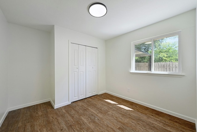 9224 Partridge Cir, Austin, TX 78758 - unfurnished bedroom featuring wood finished floors and a closet