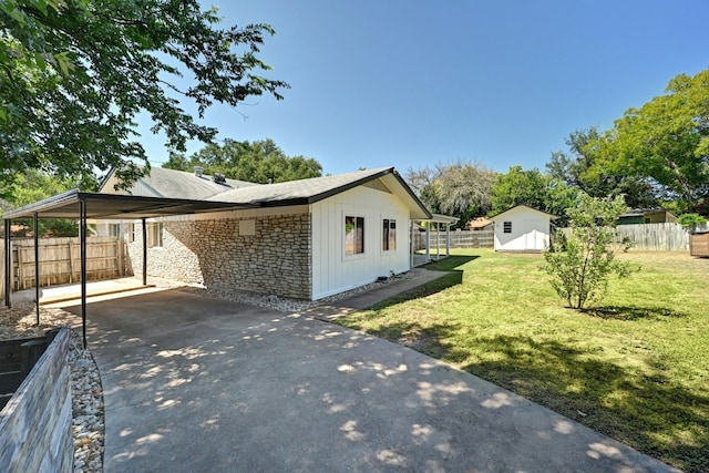 9224 Partridge Cir, Austin, TX 78758 - view of side of property with stone siding, a fenced backyard, a shed, and concrete driveway