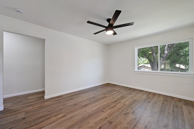 4803 Broadhill Dr, Austin, TX 78723 - unfurnished room featuring wood finished floors, a smoke detector, and a ceiling fan