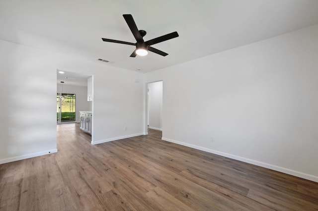4803 Broadhill Dr, Austin, TX 78723 - empty room with wood finished floors and ceiling fan