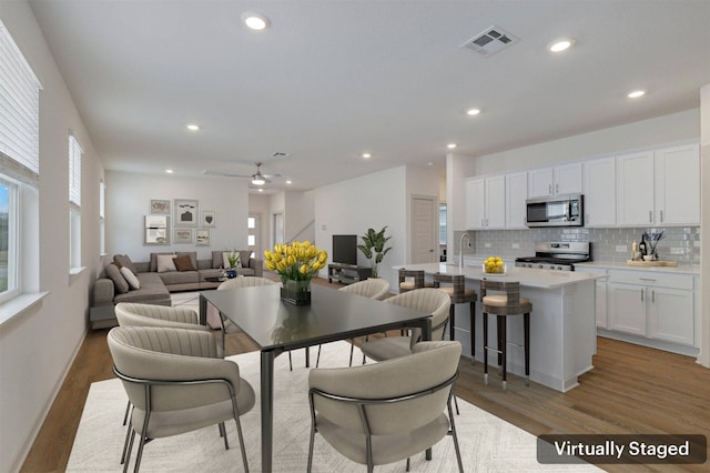 13804 Bavarian Forest Dr, Pflugerville, TX 78660 - dining space with light wood-type flooring, recessed lighting, and ceiling fan