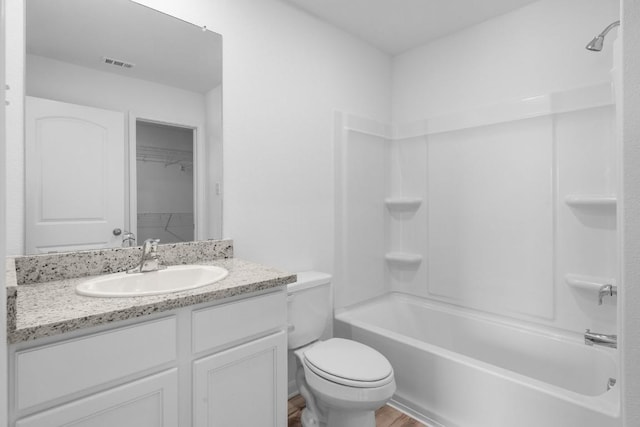 524 Aplite Pass, Maxwell, TX 78656 - full bath featuring vanity, shower / washtub combination, wood finished floors, and a walk in closet