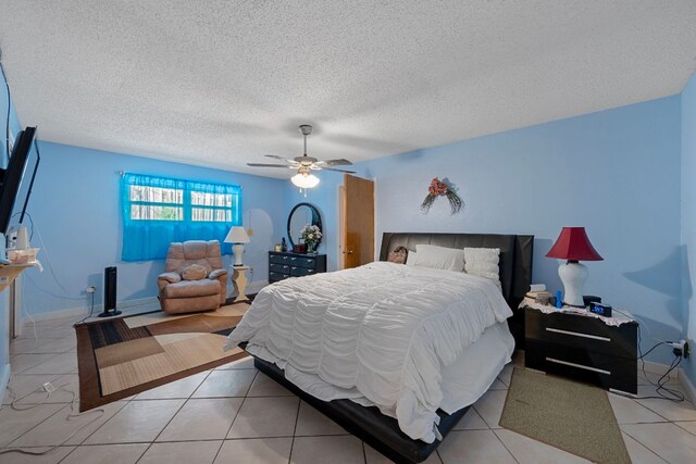 1121 Nola Ruth Blvd, Harker Heights, TX 76548 - bedroom with a ceiling fan, tile patterned flooring, and a textured ceiling