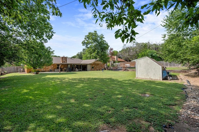 1121 Nola Ruth Blvd, Harker Heights, TX 76548 - fenced backyard featuring a shed
