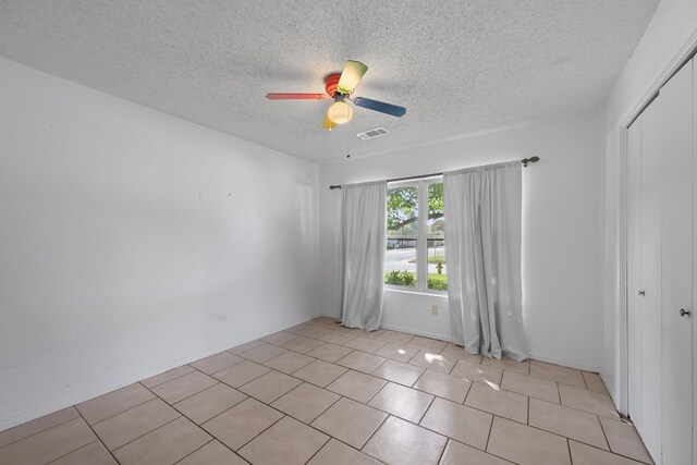 1121 Nola Ruth Blvd, Harker Heights, TX 76548 - unfurnished room with a ceiling fan, a textured ceiling, and light tile patterned floors