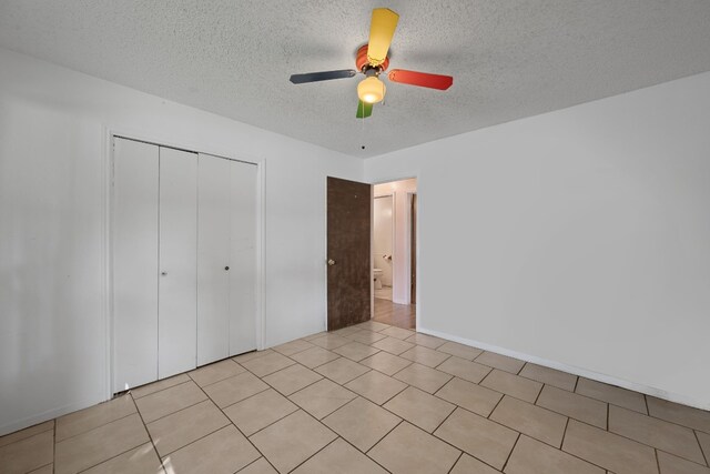 1121 Nola Ruth Blvd, Harker Heights, TX 76548 - unfurnished bedroom featuring a textured ceiling, a closet, and a ceiling fan