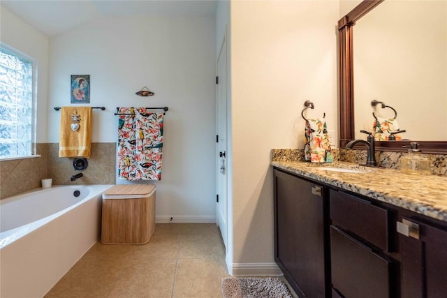 13920 Marathon Rd, Austin, TX 78717 - full bath featuring vanity, a garden tub, tile patterned floors, and vaulted ceiling
