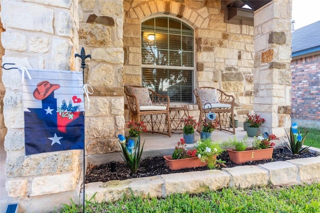 13920 Marathon Rd, Austin, TX 78717 - view of exterior entry with stone siding and a porch