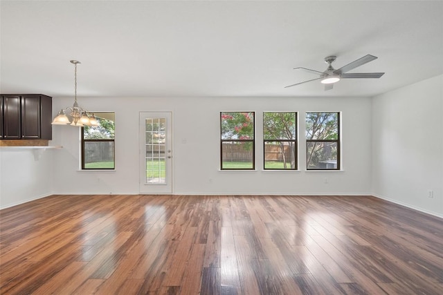 2017 Woodway Dr, Leander, TX 78641 - empty room with a chandelier, wood finished floors, and a ceiling fan