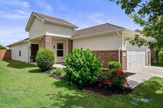 136 Gidran Trl, Georgetown, TX 78626 - view of front of house with an attached garage, driveway, brick siding, and roof with shingles