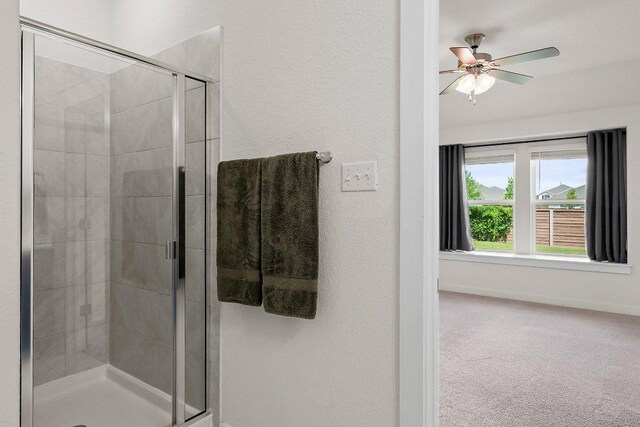 136 Gidran Trl, Georgetown, TX 78626 - bathroom with a stall shower and a ceiling fan