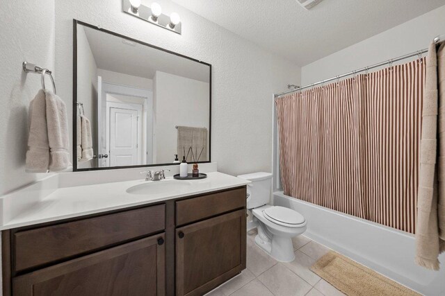 136 Gidran Trl, Georgetown, TX 78626 - full bathroom featuring vanity, shower / bathtub combination with curtain, tile patterned floors, a textured wall, and a textured ceiling