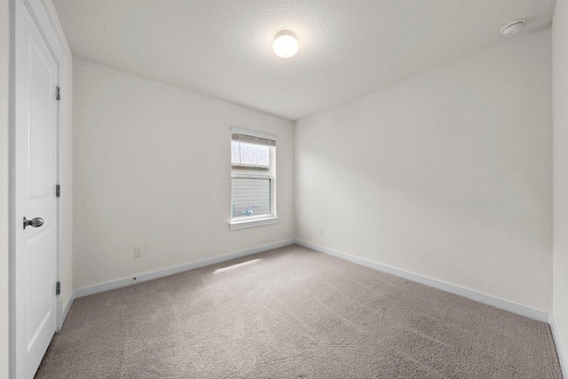 136 Gidran Trl, Georgetown, TX 78626 - spare room featuring light colored carpet and a smoke detector