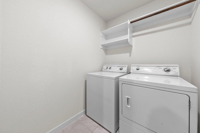 136 Gidran Trl, Georgetown, TX 78626 - laundry room featuring independent washer and dryer and light tile patterned floors