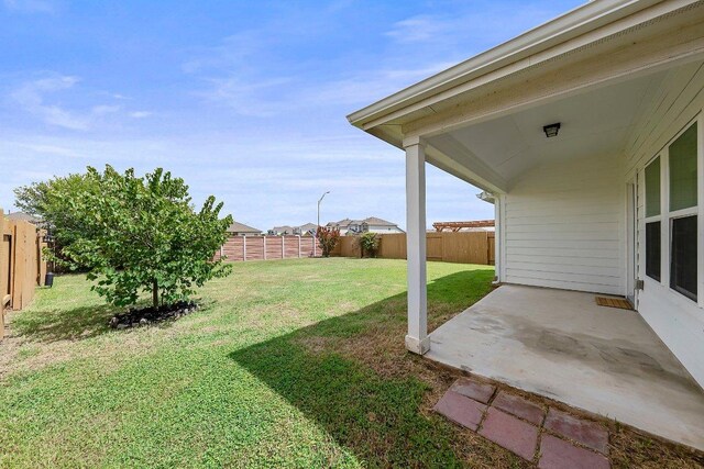 136 Gidran Trl, Georgetown, TX 78626 - fenced backyard featuring a patio area