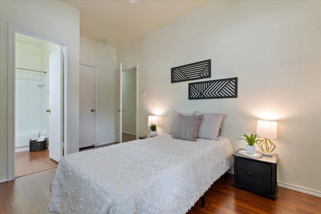 2804 Rio Grande St Unit 211, Austin, TX 78705 - bedroom featuring wood finished floors and ensuite bathroom