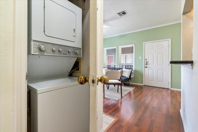 2804 Rio Grande St Unit 211, Austin, TX 78705 - laundry area featuring stacked washer and clothes dryer, crown molding, wood finished floors, and a ceiling fan