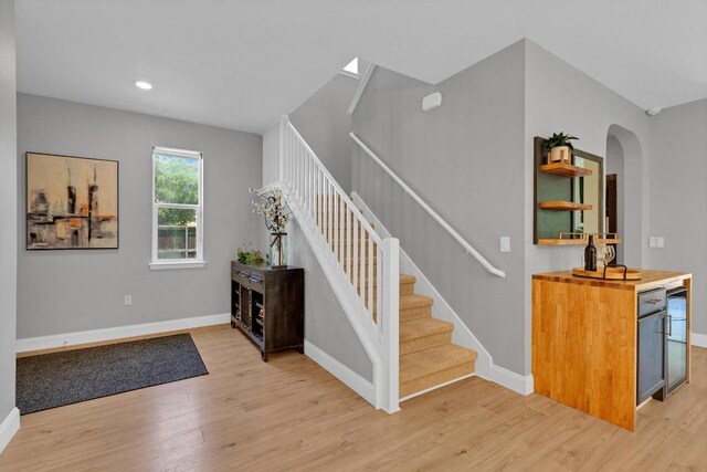 800 Sand Hill Branch Dr Unit 38, Austin, TX 78748 - staircase featuring wood finished floors, arched walkways, and recessed lighting