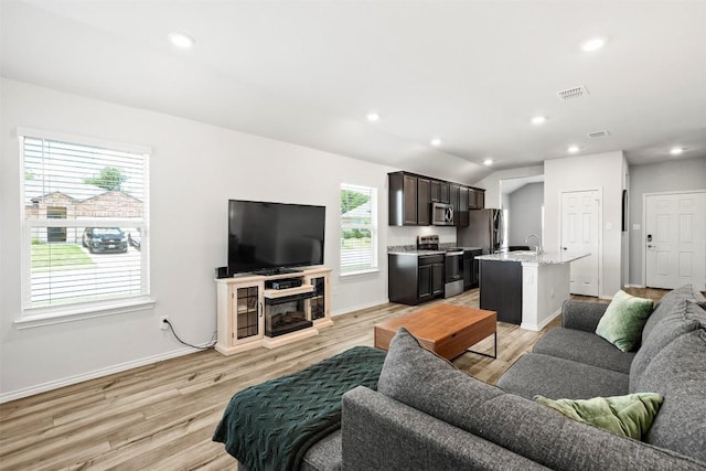 1037 Oxford Ln, Troy, TX 76579 - living room featuring light wood-style flooring and recessed lighting
