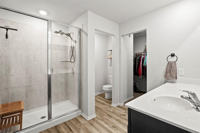 1037 Oxford Ln, Troy, TX 76579 - full bath with a stall shower, wood finished floors, a spacious closet, and double vanity