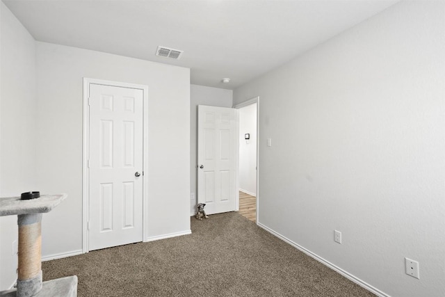 1037 Oxford Ln, Troy, TX 76579 - unfurnished bedroom featuring dark colored carpet and baseboards