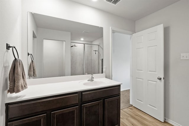 1037 Oxford Ln, Troy, TX 76579 - bathroom with vanity, wood finished floors, and a shower stall