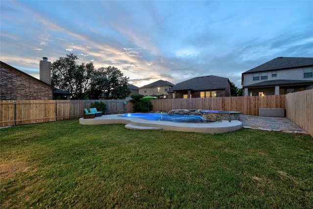 1236 Yellow Iris Rd, Leander, TX 78641 - yard at dusk with a fenced backyard and a patio