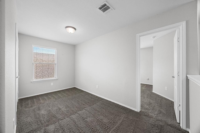 1236 Yellow Iris Rd, Leander, TX 78641 - spare room featuring dark carpet and baseboards
