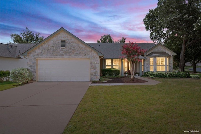 101 Goldenrod Way, Georgetown, TX 78633 - ranch-style house featuring an attached garage, stone siding, concrete driveway, and a lawn