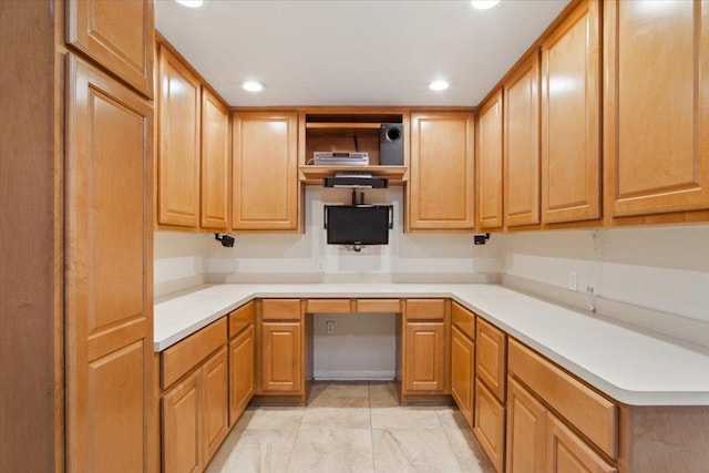 101 Goldenrod Way, Georgetown, TX 78633 - kitchen featuring recessed lighting, light marble finish floors, open shelves, light countertops, and built in desk