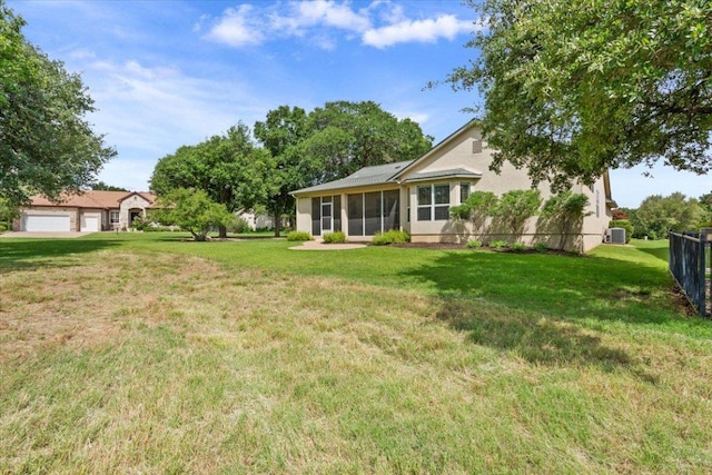 101 Goldenrod Way, Georgetown, TX 78633 - view of yard with a sunroom and a detached garage
