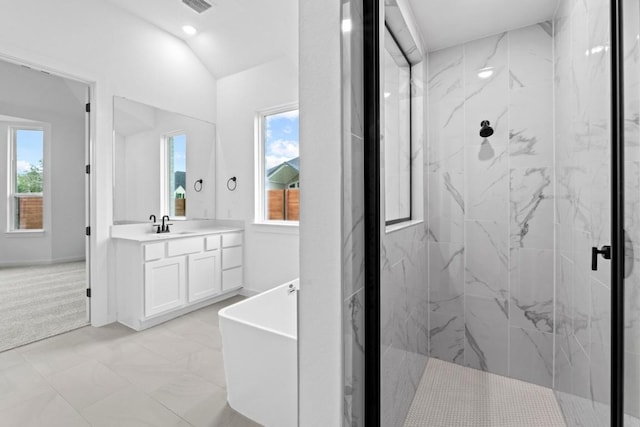 2113 Tobiano Trce, Georgetown, TX 78633 - bathroom with a marble finish shower, vanity, plenty of natural light, a freestanding tub, and vaulted ceiling