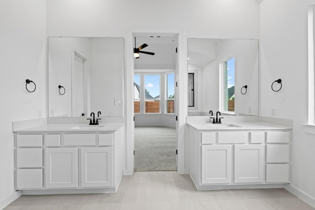 2113 Tobiano Trce, Georgetown, TX 78633 - full bath with ceiling fan, two vanities, and marble look tile flooring