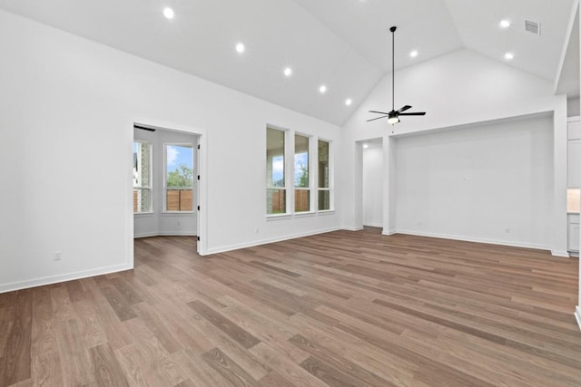 2113 Tobiano Trce, Georgetown, TX 78633 - unfurnished living room featuring recessed lighting, a ceiling fan, high vaulted ceiling, and light wood-style floors