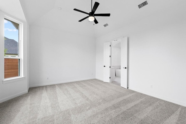 2113 Tobiano Trce, Georgetown, TX 78633 - spare room with vaulted ceiling, carpet floors, and a ceiling fan