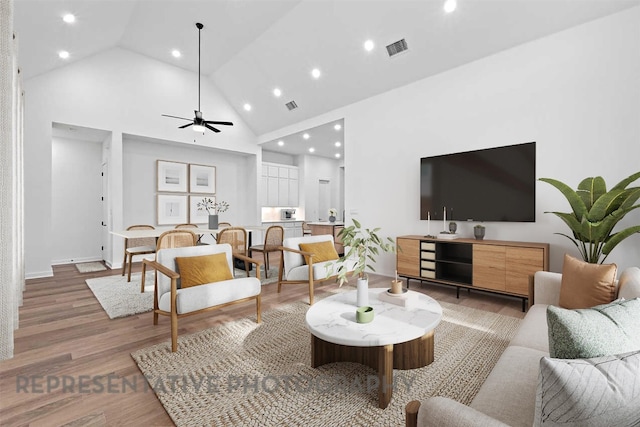 2113 Tobiano Trce, Georgetown, TX 78633 - living room with high vaulted ceiling, light wood-style flooring, a ceiling fan, and recessed lighting