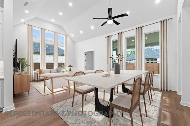 2113 Tobiano Trce, Georgetown, TX 78633 - dining space with ceiling fan, recessed lighting, wood finished floors, and high vaulted ceiling