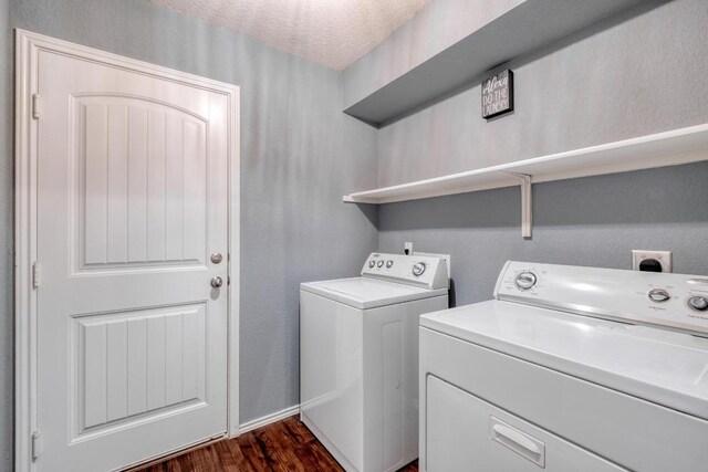 125 Lillian Dr, Taylor, TX 76574 - laundry area featuring separate washer and dryer, dark wood-style flooring, and a textured ceiling