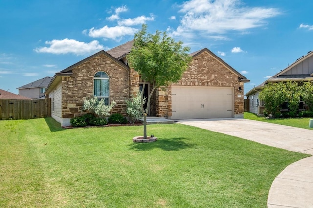 125 Lillian Dr, Taylor, TX 76574 - view of front facade featuring brick siding, a garage, and concrete driveway