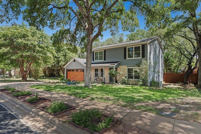 12403 Cassady Dr, Austin, TX 78727 - traditional home with stone siding and a garage