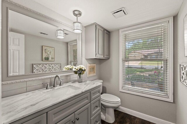 12403 Cassady Dr, Austin, TX 78727 - bathroom with vanity and wood finished floors