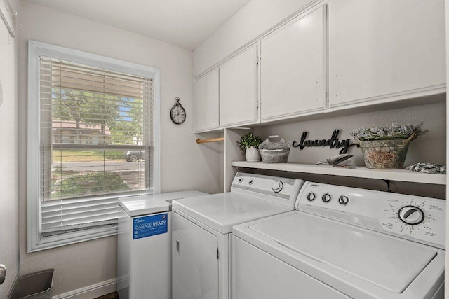 12403 Cassady Dr, Austin, TX 78727 - washroom featuring cabinet space and washer and clothes dryer